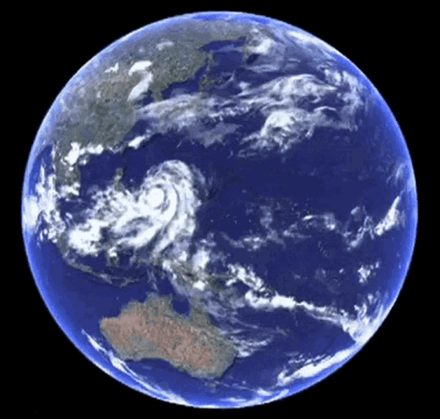 a picture of the earth from space with a hurricane in the distance