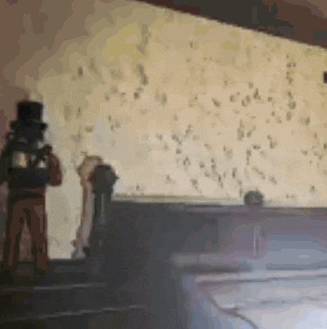 a blurry picture of a man in a top hat
