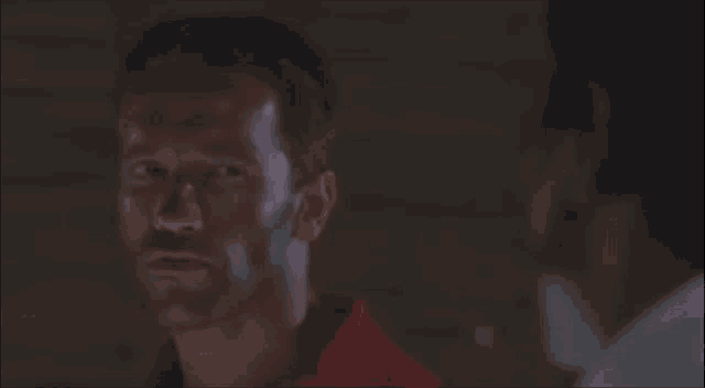a man in a red shirt says " tako je "