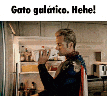 a man taking something out of a refrigerator that says gato galatico. hee!