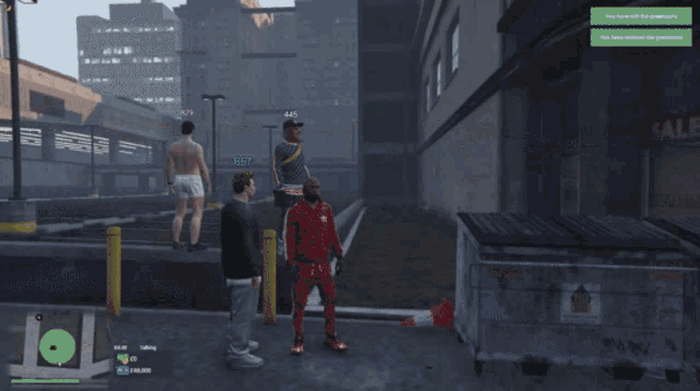 a man in a red hoodie is standing next to another man in a black shirt with the number 647 on his head