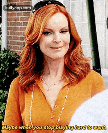 a woman with red hair is smiling and saying `` maybe when you stop playing hard to want '' .