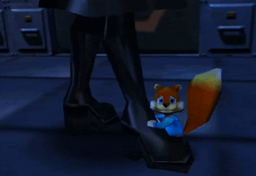 a squirrel is sitting on a person 's foot in a dark room