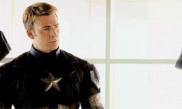 a man in a captain america uniform with a star on it