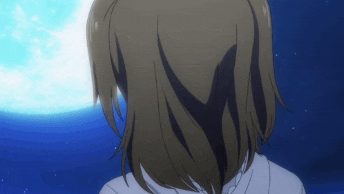 a girl with long hair looks at a full moon