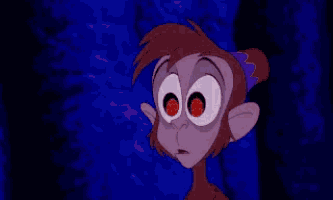 a close up of a cartoon character 's eyes with a star in them .