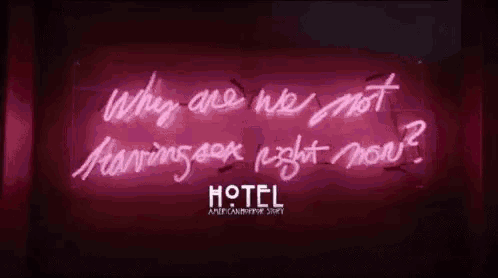 a neon sign that says `` why are we not having a good night now '' .