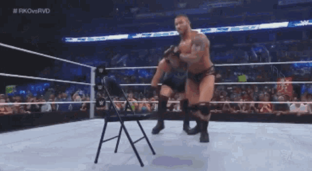 two wrestlers in a wrestling ring with the hashtag #fkovervd