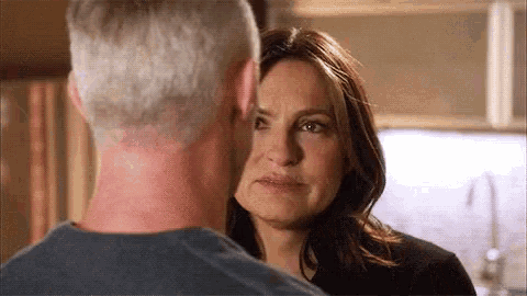 a man and woman are looking at each other