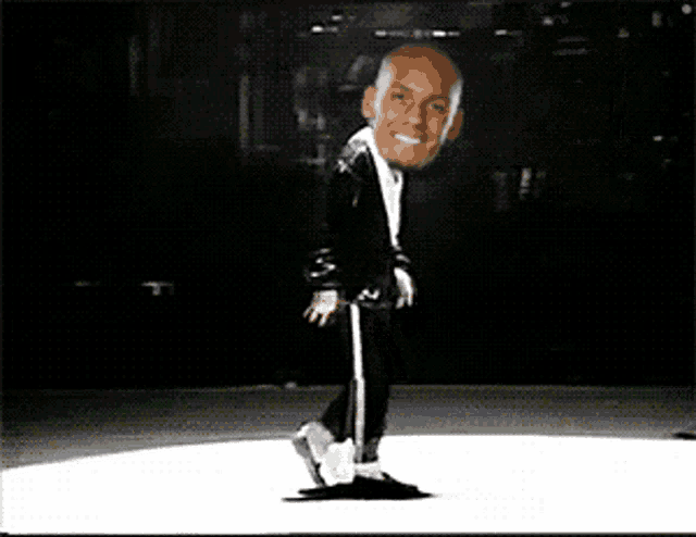 a man with a big head is dancing on a white floor