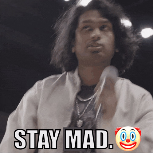 a man in a white jacket says stay mad