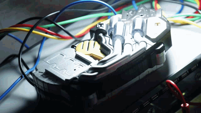 a close up of a device with wires and a key on it