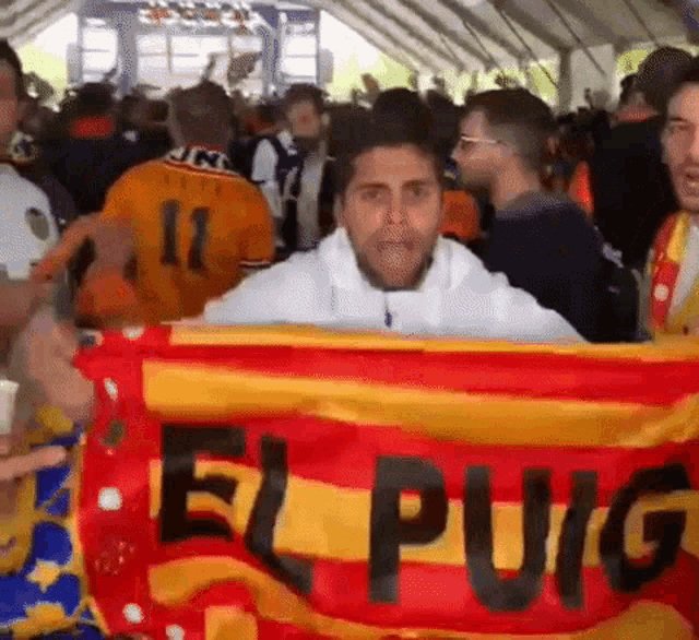 a man is holding a flag that says el pug