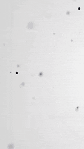 smoke is coming out of a hole in the middle of a white surface .