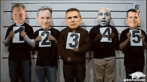 a group of men holding up signs with the numbers 1 2 3 4 5 written on them