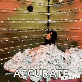 a woman is laying in a pile of money .