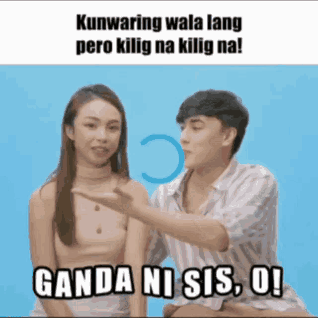 a man and a woman are sitting next to each other and the man is pointing at the woman 's arm .
