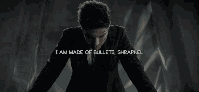 a man in a suit says i am made of bullets