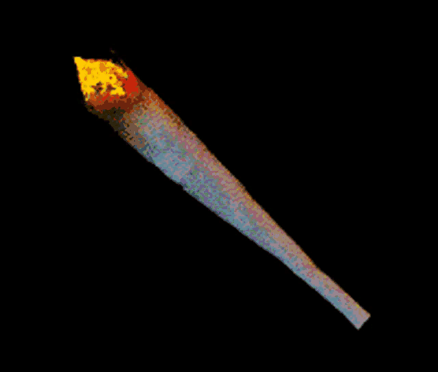 a close up of a cigarette with a yellow flame on top