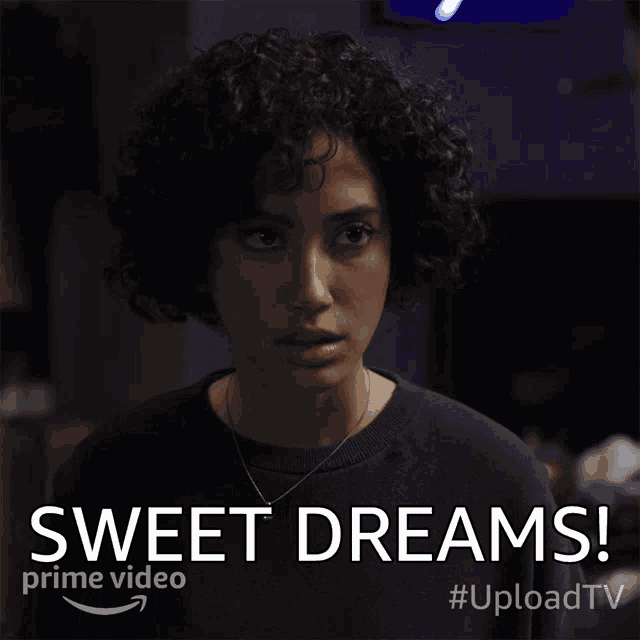 a woman with curly hair says sweet dreams on a poster