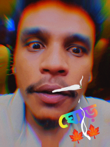a man is smoking a cigarette with a sticker that says cats on it