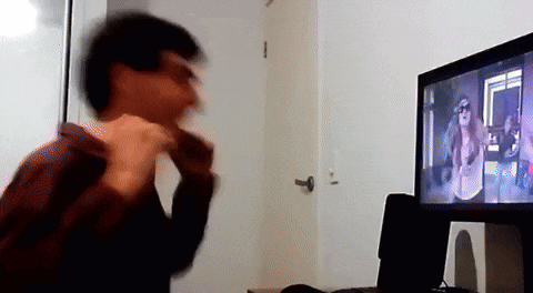 a blurry picture of a man standing in front of a computer monitor