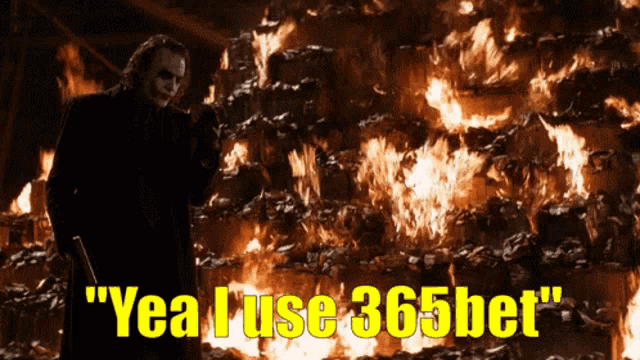 a joker standing in front of a fire with the words " yea i use 365bet " on the bottom