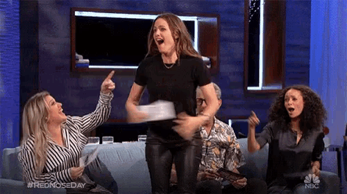 a group of women are sitting on a couch with the hashtag #rednosedayday