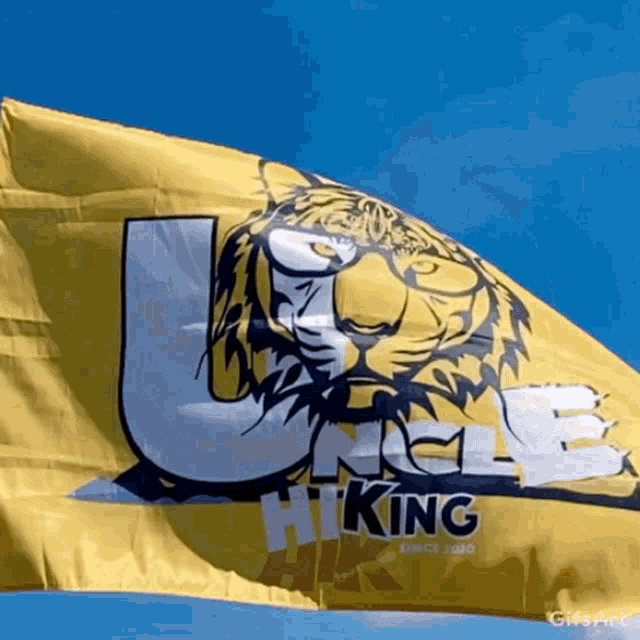 a yellow flag with a tiger on it that says uncle king