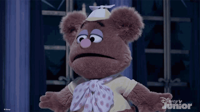 a stuffed animal with a disney junior logo on it
