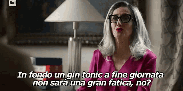 a woman wearing glasses and a pink shirt says in fondo un gin tonic a fine giornata non sera una gran fatica no