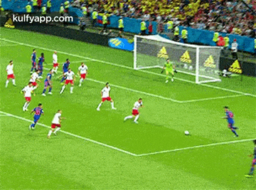 a soccer game is being played on a soccer field .