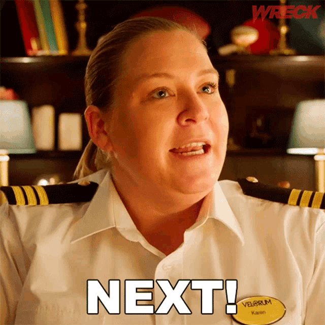 a woman in a white shirt with a name tag that says next