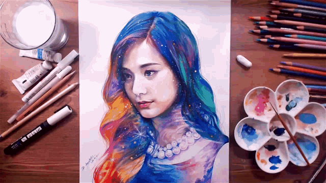 a drawing of a woman with blue hair is surrounded by colored pencils and paint