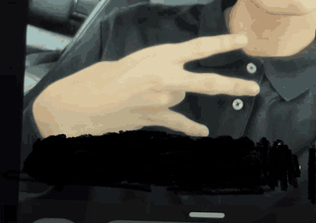 a close up of a person 's hand with their fingers crossed