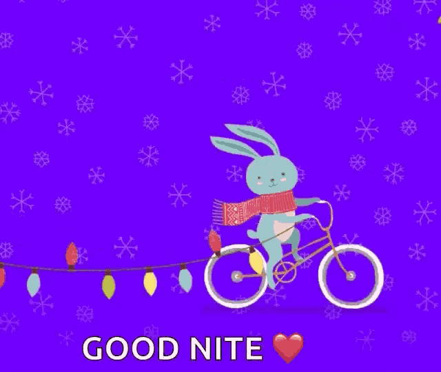 a rabbit is riding a bicycle with christmas lights on it .