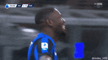 a soccer player with the number 9 on his jersey celebrates
