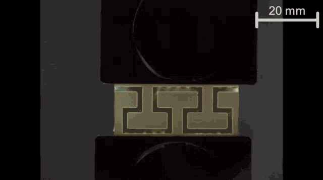 a black background with a white x on it and a 20 mm line