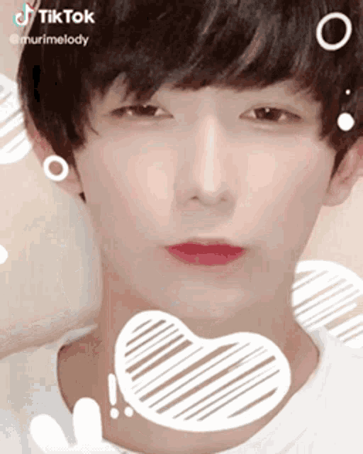 a close up of a person 's face with a heart on it and the words tiktok on the bottom left
