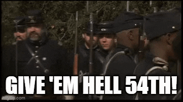 a group of men in military uniforms are standing next to each other and yelling at each other .