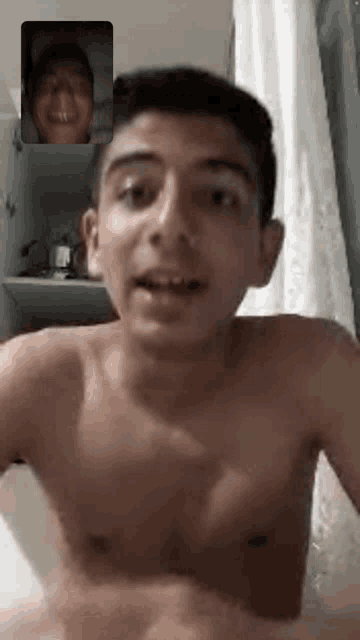 a shirtless man is on a video call with another man