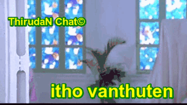 a stained glass window with a plant in front of it and the words " itho vanthuten "