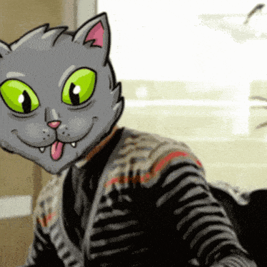 a person wearing a cat mask with green eyes sticking their tongue out