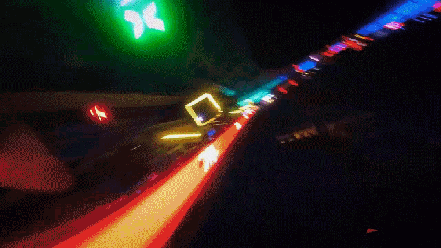a blurred image of a ferris wheel with a red x on it