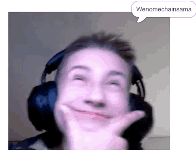 a man wearing headphones making a funny face with a speech bubble that says wenomechainsama