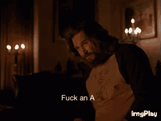 a man with a beard says fuck an a in a dark room
