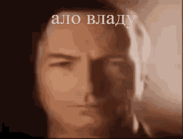 a close up of a man 's face with the words " a.o. vlady " above it