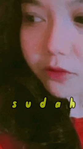 a close up of a woman 's face with ya sudahah written in yellow letters