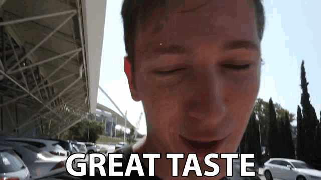 a man with his eyes closed and the words great taste behind him