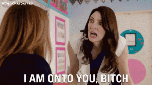 a woman is yelling at another woman with the words i am onto you bitch